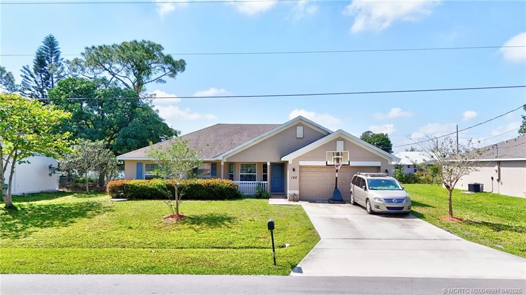 Photo of 142 SW Crescent Avenue, Port Saint Lucie, FL 34984 (MLS # M20049991)