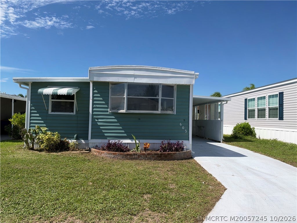 Photo of 603 Tahiti Way NE, Jensen Beach, FL 34957 (MLS # M20057245)