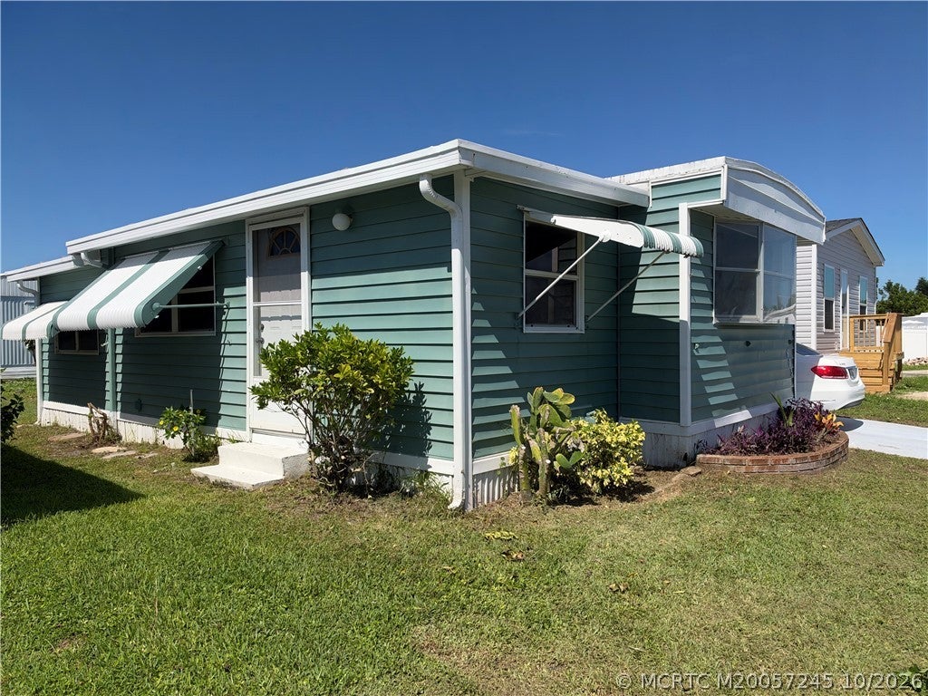 Photo of 603 Tahiti Way NE, Jensen Beach, FL 34957 (MLS # M20057245)