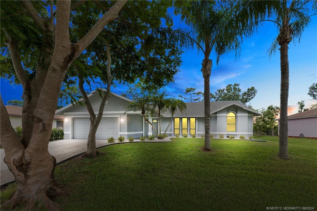 Photo of 1550 SE Clearmont Street, Port Saint Lucie, FL 34983 (MLS # M20046771)