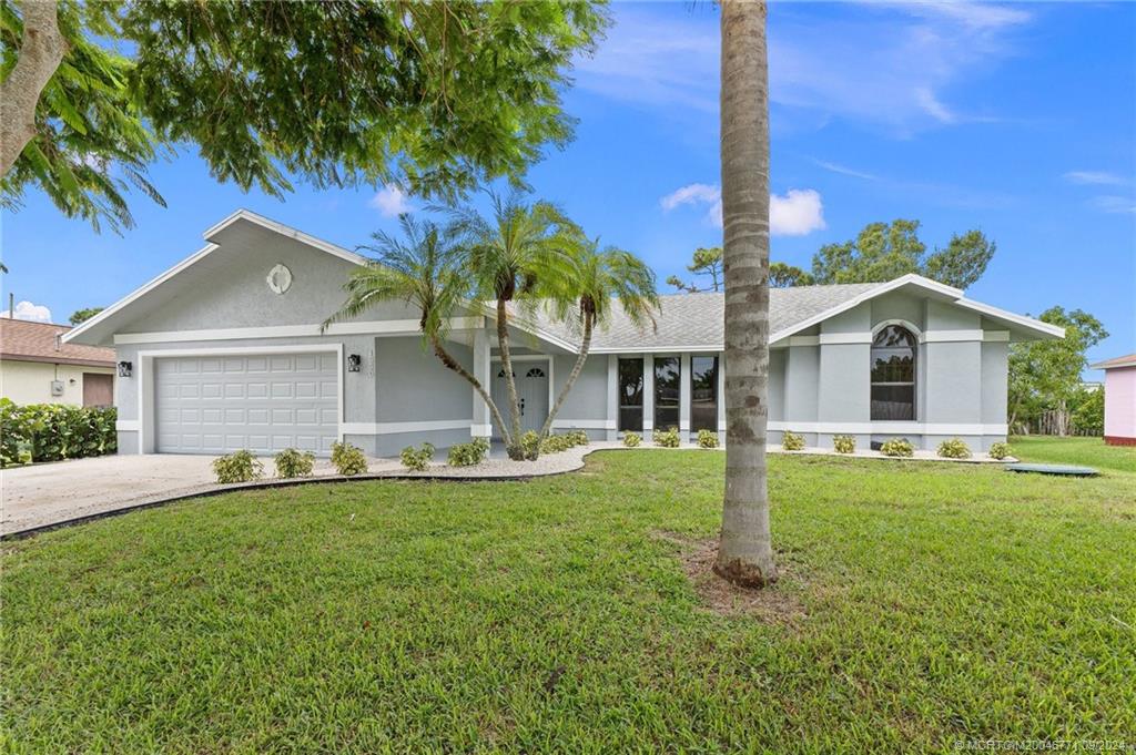 Photo of 1550 SE Clearmont Street, Port Saint Lucie, FL 34983 (MLS # M20046771)