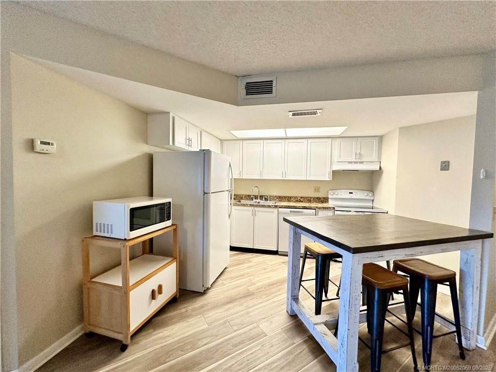 Photo of 2041 NE Collins Circle #5-1, Jensen Beach, FL 34957 (MLS # M20052059)