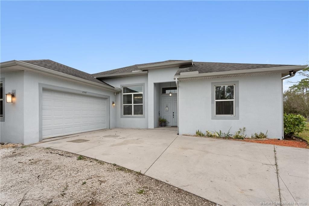 Photo of 6347 SW Travers Street, Palm City, FL 34990 (MLS # M20053592)