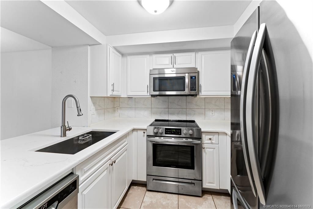 Photo of 1500 SE Royal Green Circle #104, Port Saint Lucie, FL 34952 (MLS # M20040114)