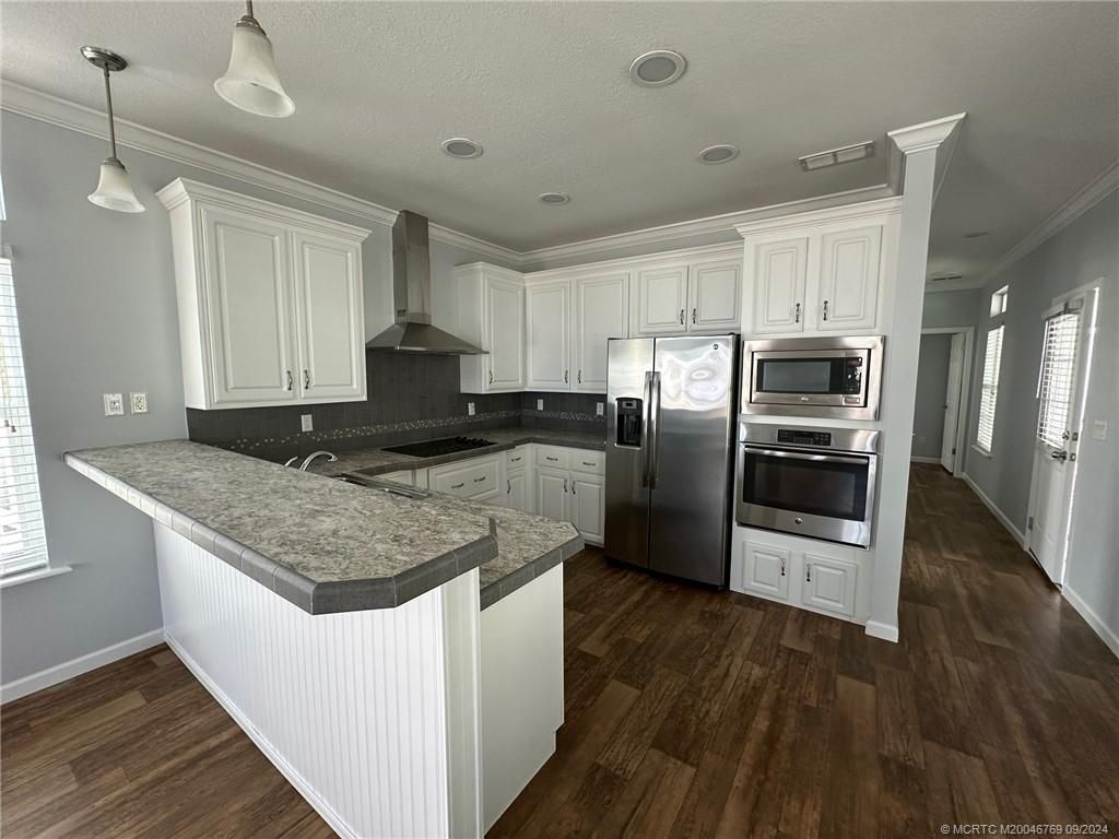 Photo of 13 NE Nautical Drive, Jensen Beach, FL 34957 (MLS # M20046769)