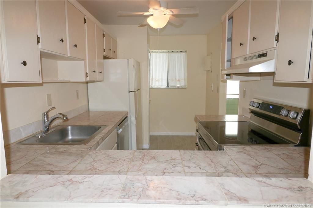 Photo of 5463 SE Miles Grant Road #216, Stuart, FL 34997 (MLS # M20041772)