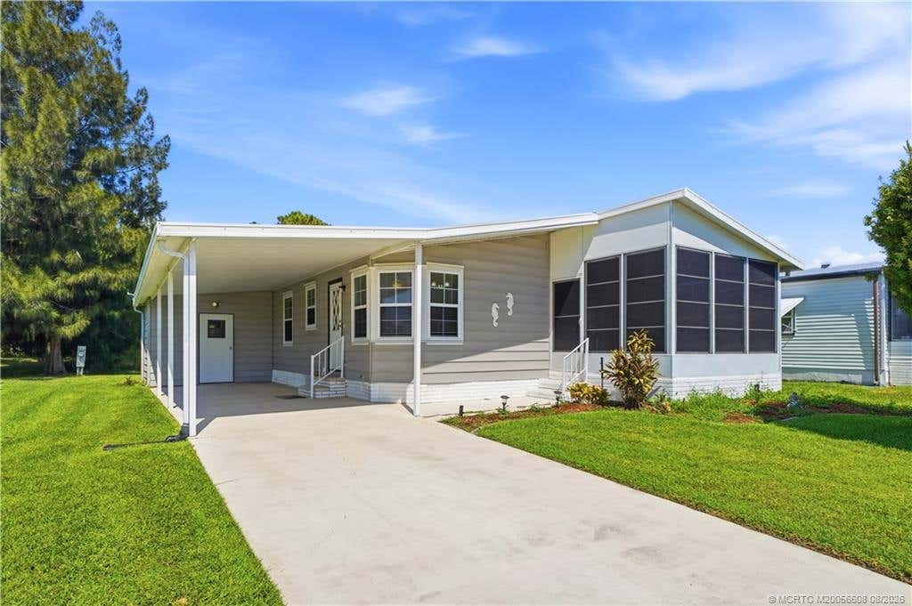 Photo of 2917 Fiddlewood Circle, Fort Pierce, FL 34952 (MLS # M20056608)