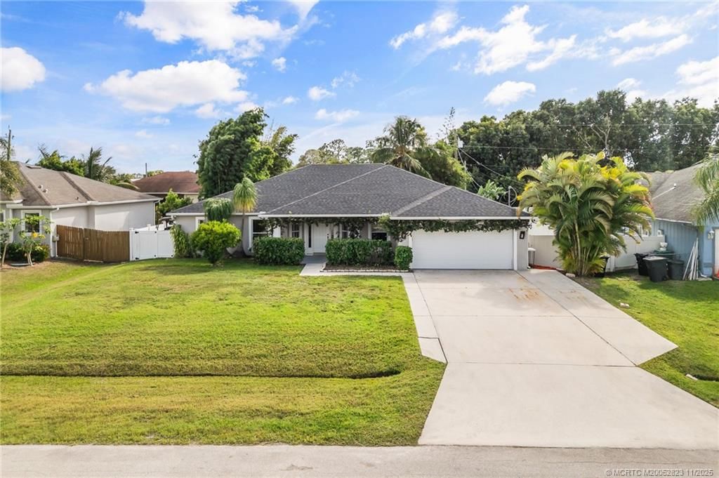 Photo of 1074 SW Eckard Avenue, Port Saint Lucie, FL 34953 (MLS # M20052823)