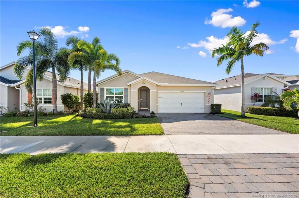 Photo of 1610 NE Skyhigh Terrace, Jensen Beach, FL 34957 (MLS # M20053664)