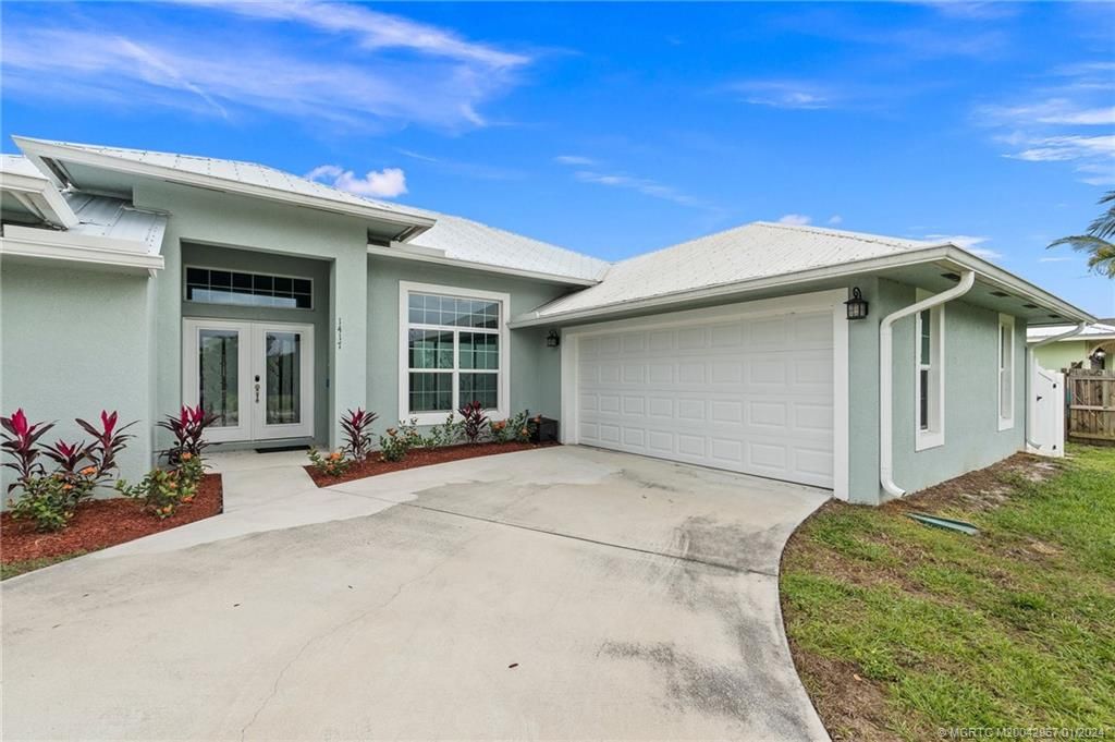 Photo of 1417 SW Aachen Avenue, Port Saint Lucie, FL 34953 (MLS # M20042967)