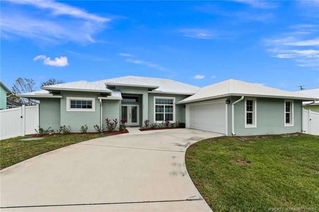 Photo of 1417 SW Aachen Avenue, Port Saint Lucie, FL 34953 (MLS # M20042967)
