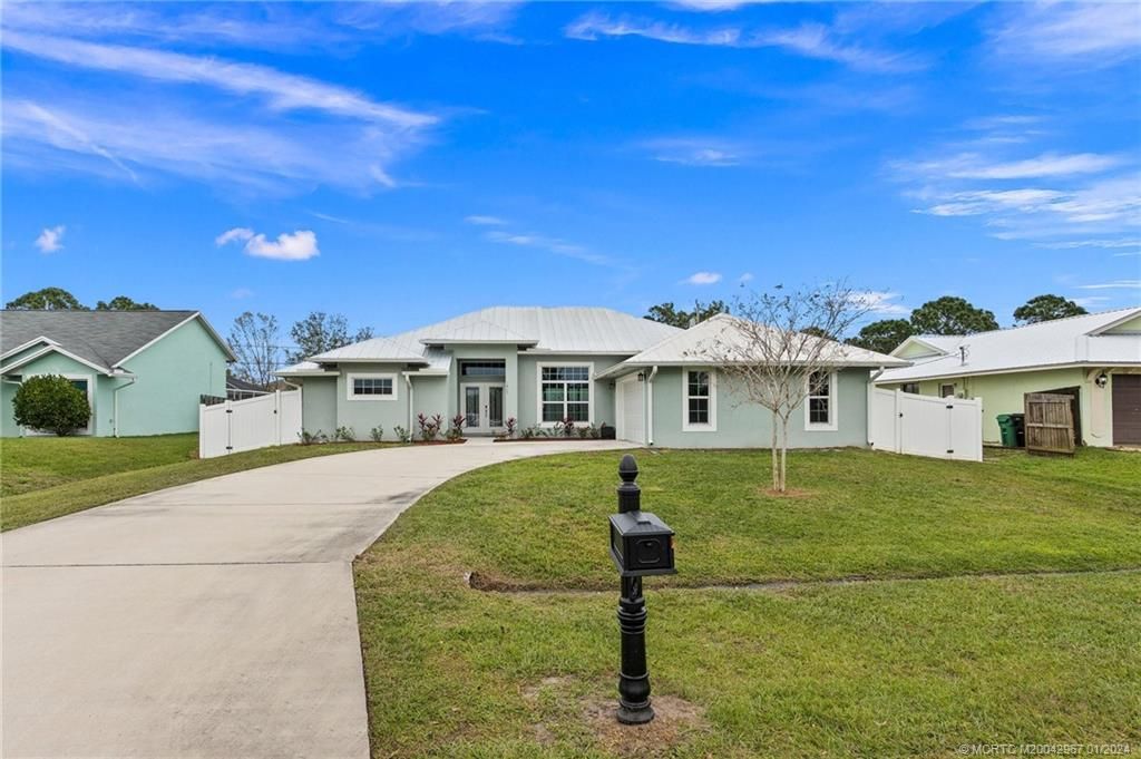 Photo of 1417 SW Aachen Avenue, Port Saint Lucie, FL 34953 (MLS # M20042967)