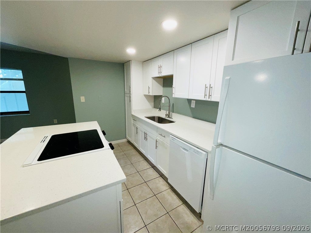 Photo of 1206 Carlton Court #104, Fort Pierce, FL 34949 (MLS # M20056793)