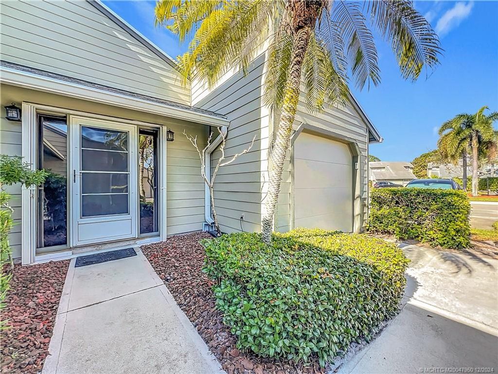 Photo of 910 NE Sandalwood Place, Jensen Beach, FL 34957 (MLS # M20047950)