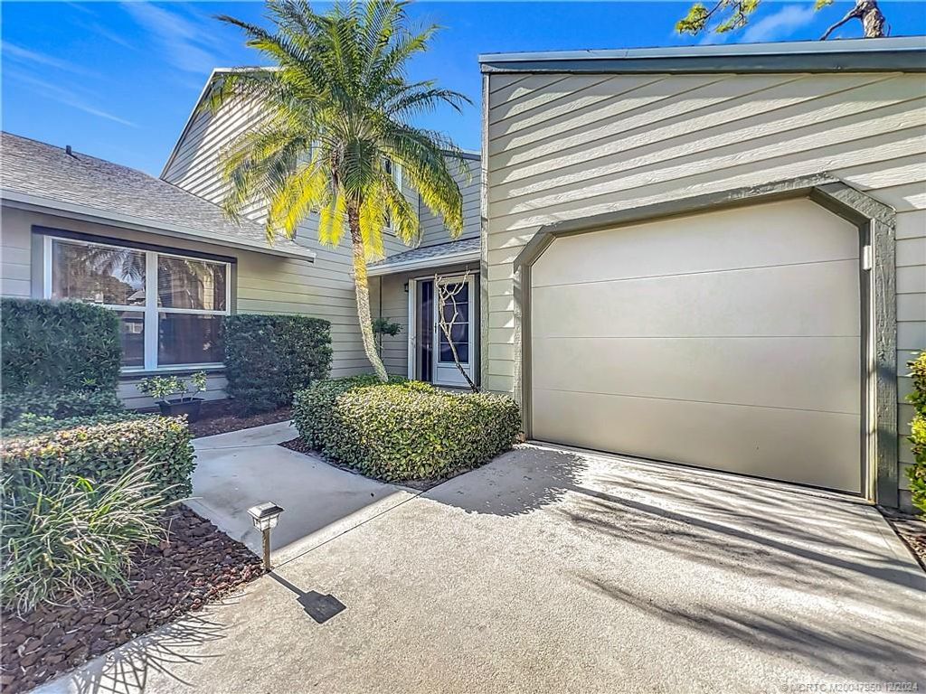 Photo of 910 NE Sandalwood Place, Jensen Beach, FL 34957 (MLS # M20047950)