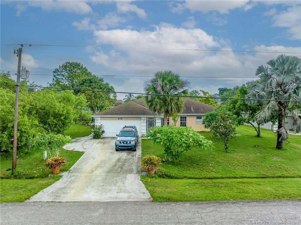 Photo of 161 SE Whitmore Drive, Port Saint Lucie, FL 34984 (MLS # M20039642)