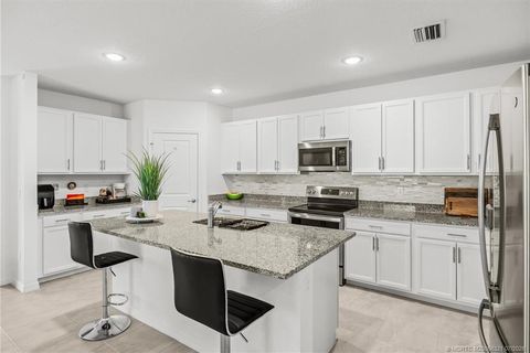 Photo of 837 SW California Boulevard, Port Saint Lucie, FL 34953 (MLS # M20056321)