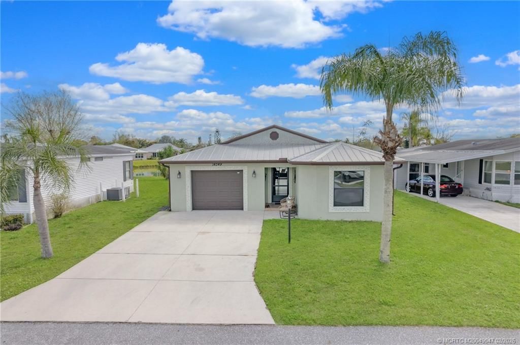 Photo of 14349 Dulce Real Avenue, Fort Pierce, FL 34951 (MLS # M20049047)