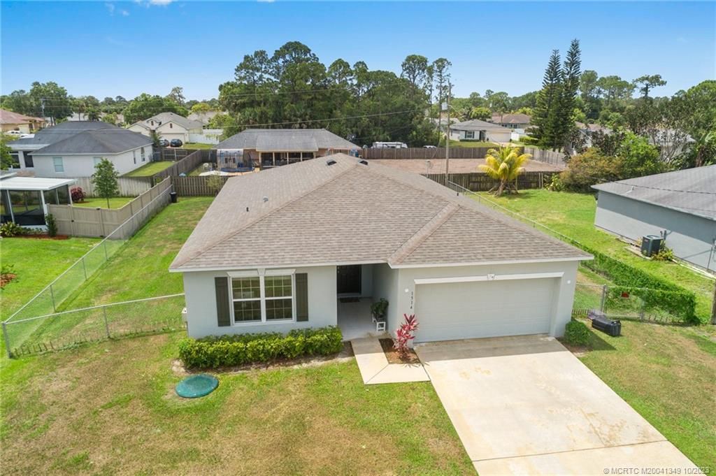 Photo of 1514 SW Kosnar Avenue, Port Saint Lucie, FL 34953 (MLS # M20041349)