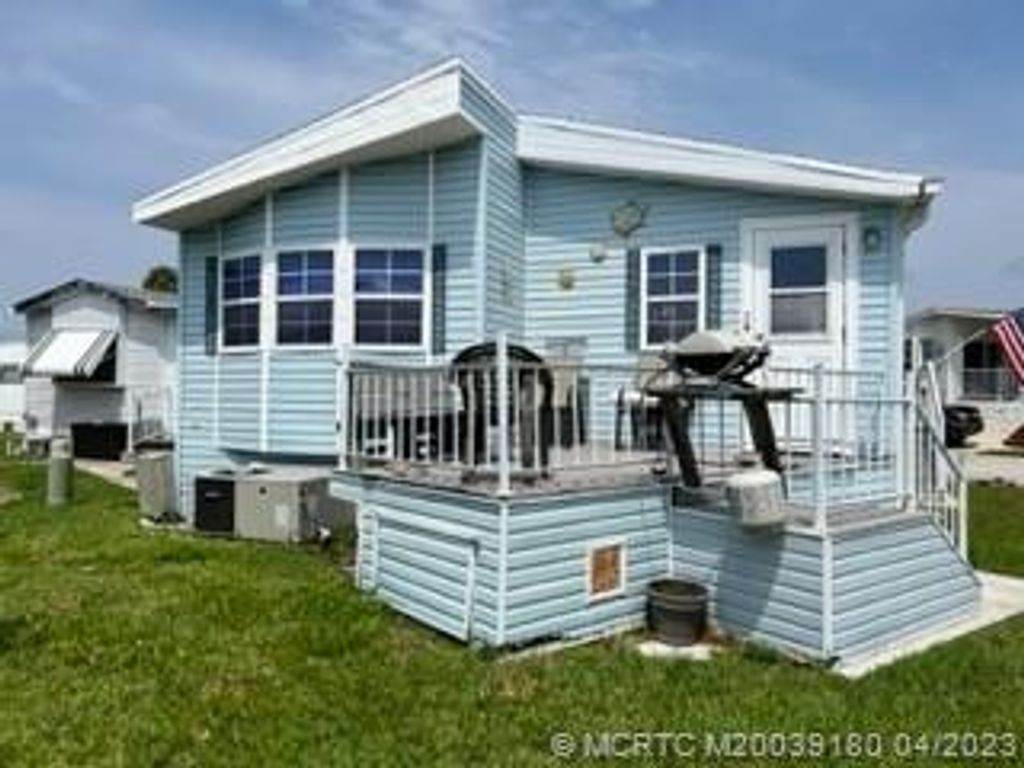 Photo of 876 Nettles Boulevard, Jensen Beach, FL 34957 (MLS # M20039180)