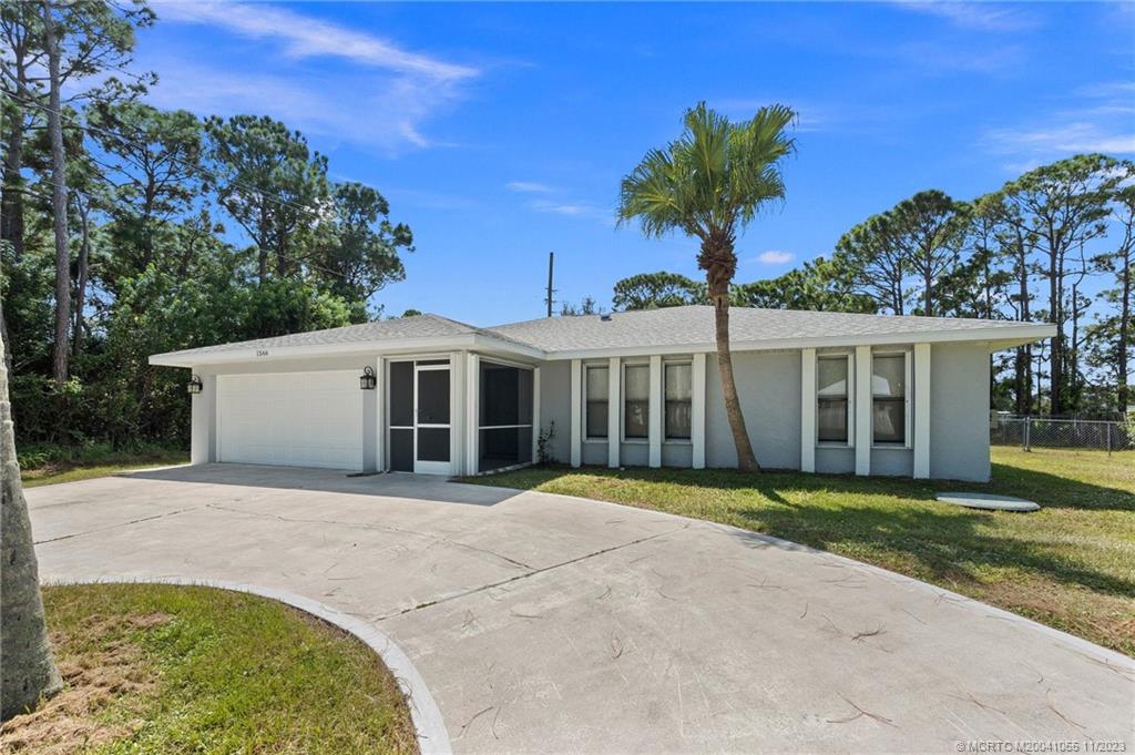 Photo of 1566 SE Clearmont Street, Port Saint Lucie, FL 34983 (MLS # M20041055)