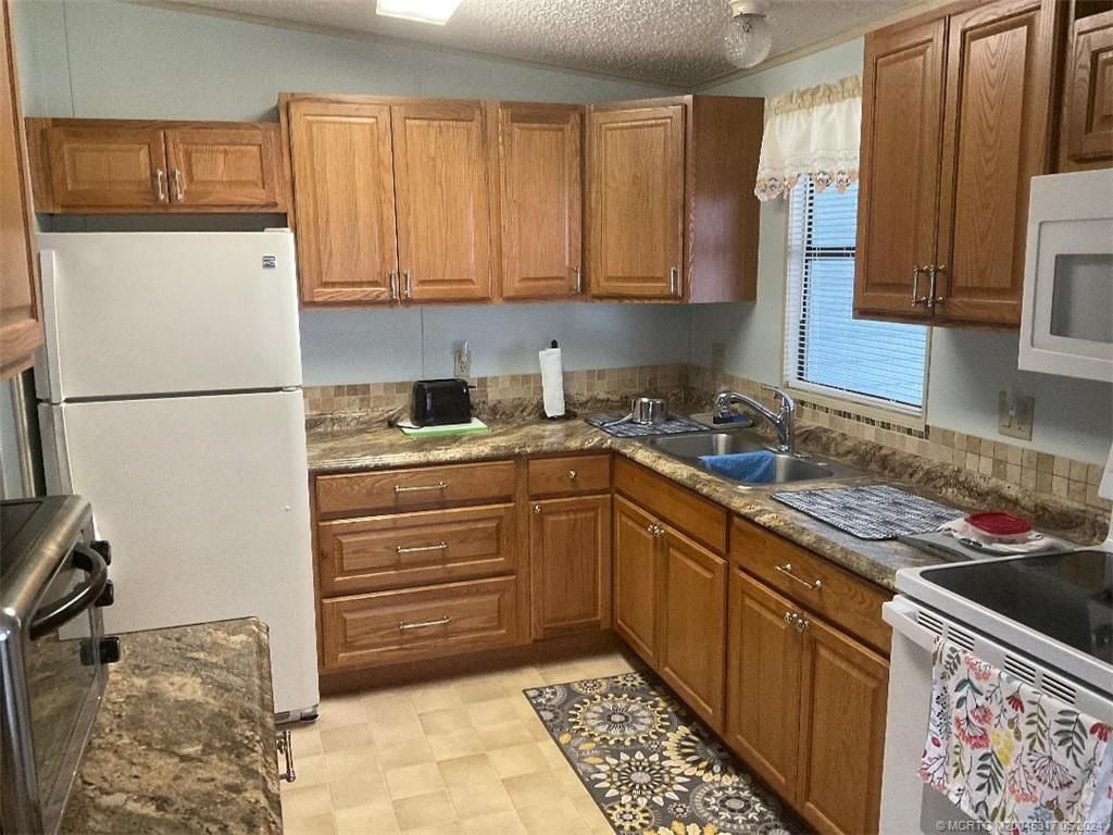 Photo of 16332 SW Indianwood Circle, Indiantown, FL 34956 (MLS # M20045317)