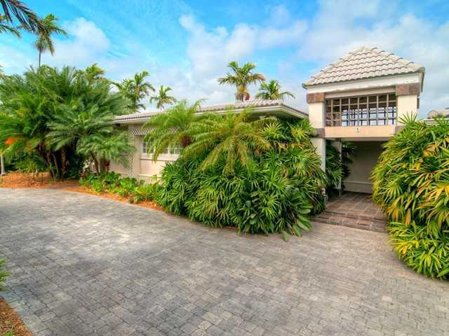 5 BEDROOMS, 6.5 BATHS, ON A HUGE BAYFRONT LOT (19,688 SQ. FT.) APPROXIMATELY 112 LINEAR FT. ON THE BAY WITH DOCK AND BOAT LIFT. CERAMIC TILE HEATED POOL & HUGE COVERED TERRACE OVERLOOKING THE BAY; COVERED OUTDOOR KITCHEN AREA & POOL BATH. 3 CAR GARAGE WITH MAIDS BEDROOM & FULL BATH. COURTYARD ENTRY, HUGE ENTRY FOYER WITH MARBLE FLOORS. BIG KITCHEN EQUIPPED FOR KOSHER USE. HUGE MASTER SUITE WITH SPA BATH (STEAM SHOWER, DUAL SINKS, & SOAKING TUB). FULL SECURITY SYSTEM, NATURAL GAS, GENERATOR READY.