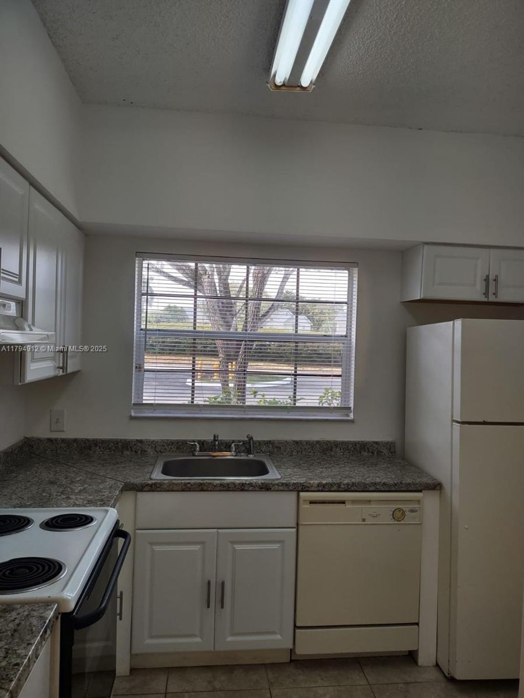 Photo of 680 Cypress Club Way #E10, Deerfield Beach, FL 33064 (MLS # A11794912)