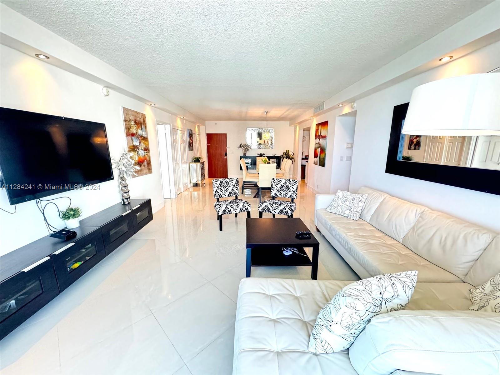 MID-LUX 2BR/2BA CONDO ON HOLLYWOOD BEACH. NICELY UPGRADED INTERIOR,8TH FL/CORNER UNIT W/EXPANSIVE EAST/NE OCEAN VIEW.LARGEST 2/2. MBR FEAT; ON-SUITE BATH, FLOOR TO CEILING WINDOW.SPLIT FLOOR PLAN FOR PRIVACY.WHITE PORCELAIN FLOORS THROUGHOUT, OPEN KITCHEN,STAINLESS STEEL APPLIANCES, GRANITE COUNTERS. NICE DECOR & FULLY FURNISHED WITH 3 QUEEN BEDS, WHITE LEATHER SECT SOFA, 6 SEAT DINING,3 TVS, BALCONY FURNITURE TO ENJOY THE OCEAN VIEWS. BUILDING FEATURES 2 HEATED POOLS,2 BIZ CENTERS, BILLIARDS, SOCIAL ROOM, CAR WASH AREA, CAFE & DENTIST OFFICE.24HR SECURITY/CONCIERGE. CENTRALLY LOCATED BETWEEN FT LAUDERDALE AIRPORT & SOUTH BEACH.NEAR ALL SHOPPING MALLS, GROCERY, BANKING, 2 CASINOS & FAMOUS HOLLYWOOD BROADWALK. AVAILABLE SEASONALLY, CORPORATE RELOCATION. NEXT AVAILABLE 8/1/25