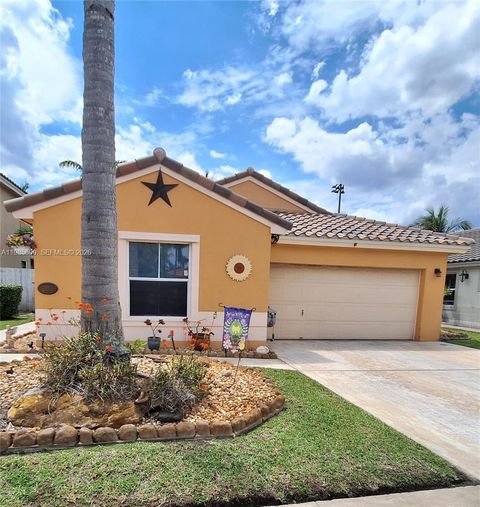 Photo of 2102 NW 193rd Ave, Pembroke Pines, FL 33029 (MLS # A11985600)