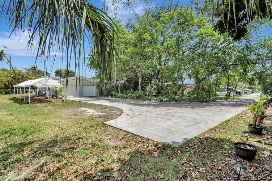 Discover this beautifully remodeled (2020) 3-bedroom, 2-bathroom home in the heart of Palmetto Bay! Nestled on a private .48-acre lot at the end of a dead-end street, this home offers peace and tranquility with lush greenery and ample outdoor space—plenty of room to add a pool. The inviting front sitting area is perfect for relaxing, while the oversized 2-car garage provides extra storage and convenience. Impact windows throughout offer security and energy efficiency. A rare find in a sought-after location, walking distance to Palmetto Bay park—don’t miss out on this cozy and private retreat!