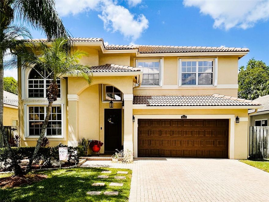 THE GEM HOME YOU'RE LOOKING FOR! Spacious 4 BR/3 FULL-BATH home in WESTON'S EMERALD ESTATES, offering the best in location, amenities, schools, shopping & comfort. The 2,843 SF, 2-STORY UPDATED HOME includes volume ceilings, peninsula kitchen w/ granite tops, stainless appliances, a roomy second floor loft & much more. Large format tile on first floor & wood lam. on second. Oversized windows bring ample natural light & are protected with accordion shutters (impact entry & garage doors also). Private backyard with concrete deck perfect for entertaining & room for a custom pool. Paver driveway with 2-car garage. The beautiful community pool with fitness room is currently being upgraded. Securely GATED COMMUNITY with A+ SCHOOLS. Publix shopping ctr w/ restaurants & services just minutes away.