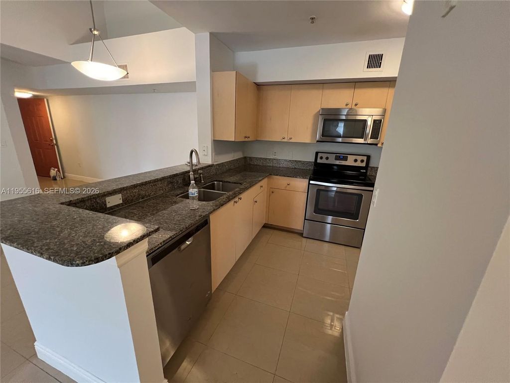 Photo of 2496 Centergate Dr #307, Miramar, FL 33025 (MLS # A11955616)