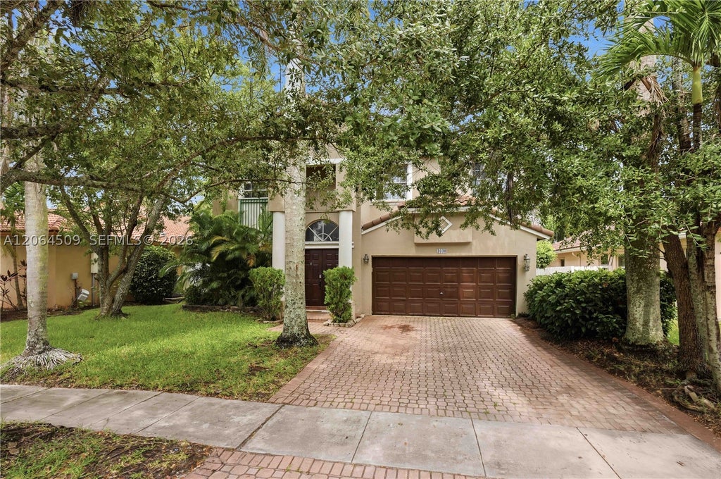 Photo of 1040 NW 185th Ave, Pembroke Pines, FL 33029 (MLS # A12064509)