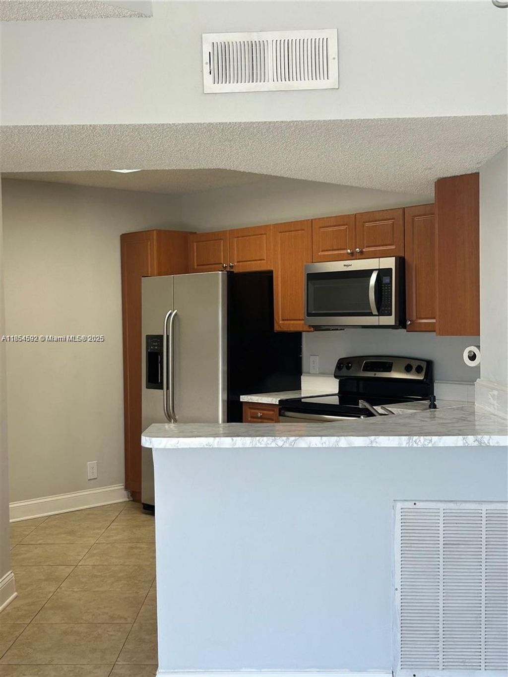 Photo of 8821 Wiles Rd #305, Coral Springs, FL 33067 (MLS # A11854592)