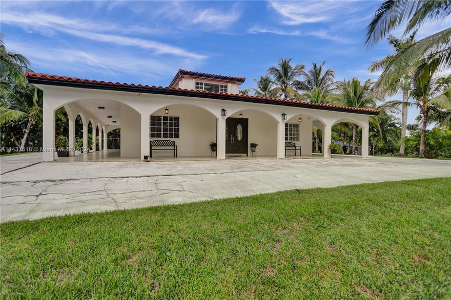 Very nice 3 bed/2 bath 1800 sf Mediterranean home on rarely available 3.41 acre gated and fenced private compound in very exclusive Sunshine Ranches on of the highest elevations in area. Area is transforming in to multi million dollar properties in one of the best areas in all of South Florida. You can transform current home in to your custom built mansion. Pristine grounds with plenty of room for horse stables, tennis court, basketball court etc. No HOA, Sunrise city water. Property has 10 different types of exotic coconut palm and fruit trees which could generate income and agricultural exemption. Easy access to major highways and close to shopping, restaurants and schools!