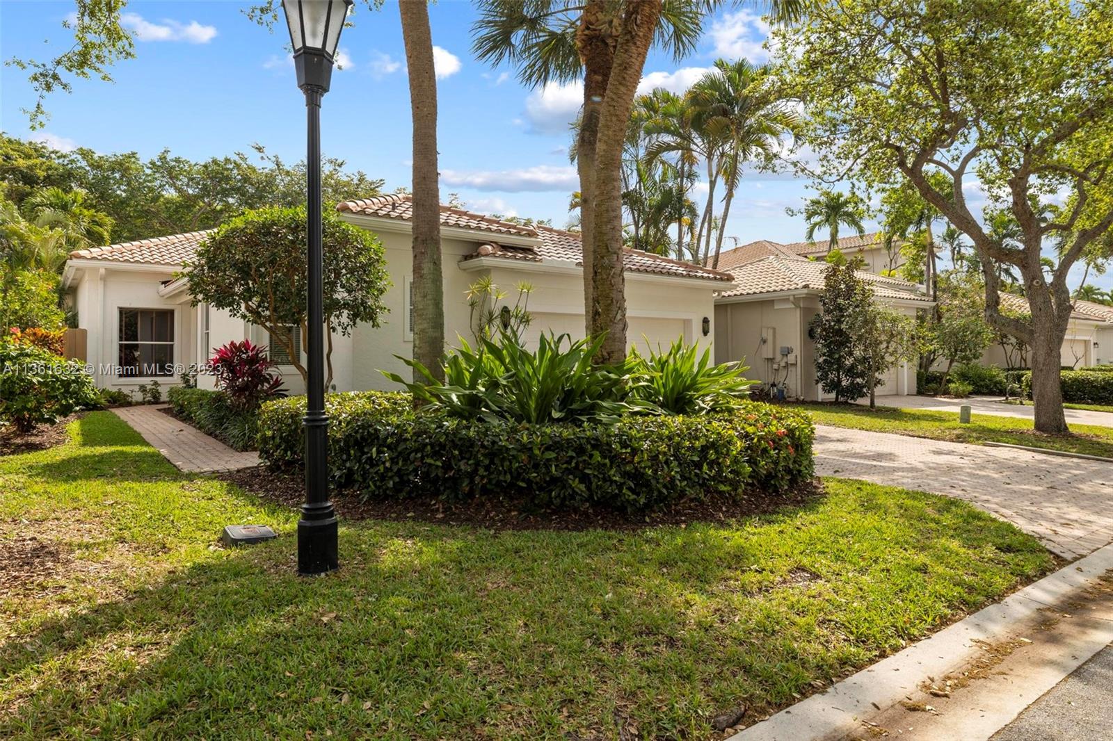 The Banyans is a priv, guard-gated enclave of single family houses within Broken Sound C.C~ This immaculate, open 2,393 SF home has 3 spacious bdrms + 3 full bathrs~ Volume ceilings thru-out + x-large windows lend a sunny ambiance to the home~Large neutral ceramic tiles on the diag, cover the living areas~ BRAND NEW ROOF with 30 Yr Warranty~ The Kitch has stainless appli + granite cntrs~ There is a cntr island + all bottom Cabinet drawers are pull-out~The pool is adjacent to a shaded Lanai+ is surrounded by thick greenery for privacy~ This pet friendly, treelined neighborhood welcomes you to walk + mingle with your neighbors~ There is a large community pool + tot lot exclusively for the Banyans~The home is totally wired for ADT Security + has central vac system~ Membership Fee is $90,000.