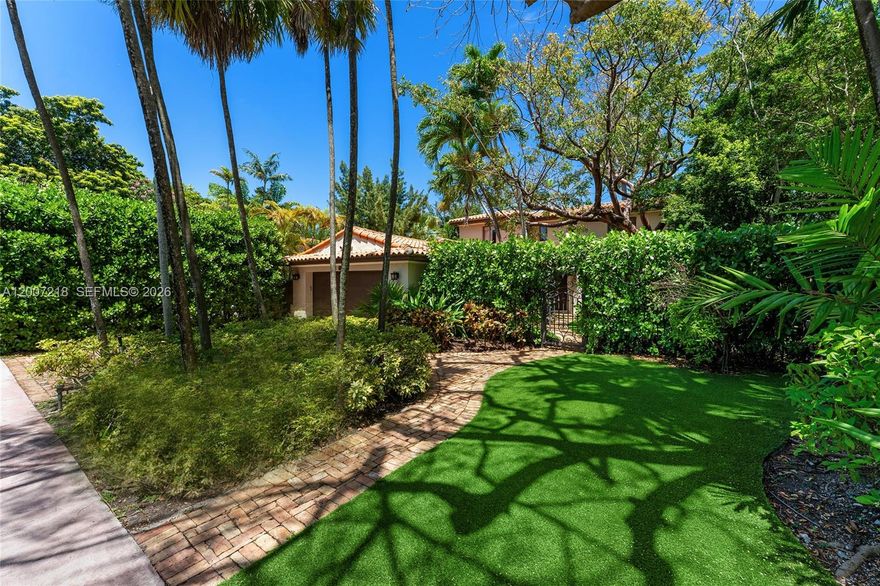 This enchanting 2-story Mediterranean Spanish style villa sits on a 7,500 SF lot, offering 4BR (including staff with full bath) and 3 full bathrooms plus 1 half bath. Fully gated with lush mature landscaping, soaring palms, and a Chicago brick driveway leading to a serene interior courtyard with shade tree and seating. Features include a barrel tile roof, 2-car garage, and additional parking. Spacious living room with wood-burning fireplace, terracotta picket-and-square-set tile floors, and courtyard views. Family room sits just beyond with direct access to the pool deck. Private dining area connects seamlessly to the kitchen and opens to the backyard. Kitchen features Crema Marfil marble floors, quartz countertops, refinished cabinetry, gas cooktop, Fisher & Paykel refrigeration, and Maytag dishwasher. Staff bedroom with en-suite bath and full laundry room complete the first floor. Upstairs, the principal suite offers high ceilings, dual closets, courtyard views, and a spa-style bath with soaking tub and glass shower. Two additional bedrooms share a full bath in the hallway. Backyard highlights include a Chicago brick deck, coral stone rimmed pool, and multiple seating areas. Ideally located just a 10–15 minute walk to pristine beaches, with access to world-class dining, fine shops, top-rated schools, golf courses, Downtown Miami, cultural/sporting venues, and Miami International Airport.