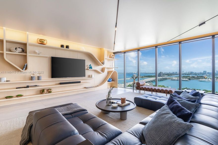 This spectacular residence encompasses 4 bedrooms, 5 1/2 baths, maid quarters and spacious balconies. The interior design carries the curvilinear exoskeleton of the building mirroring the movement of the water with natural fine materials such as light oak wall coverings, imported marble, quartz, designer wall paper, automated shades. This unit is absolutely move-in ready for the most discerning client.
Also offered furnished at $8,000.000.