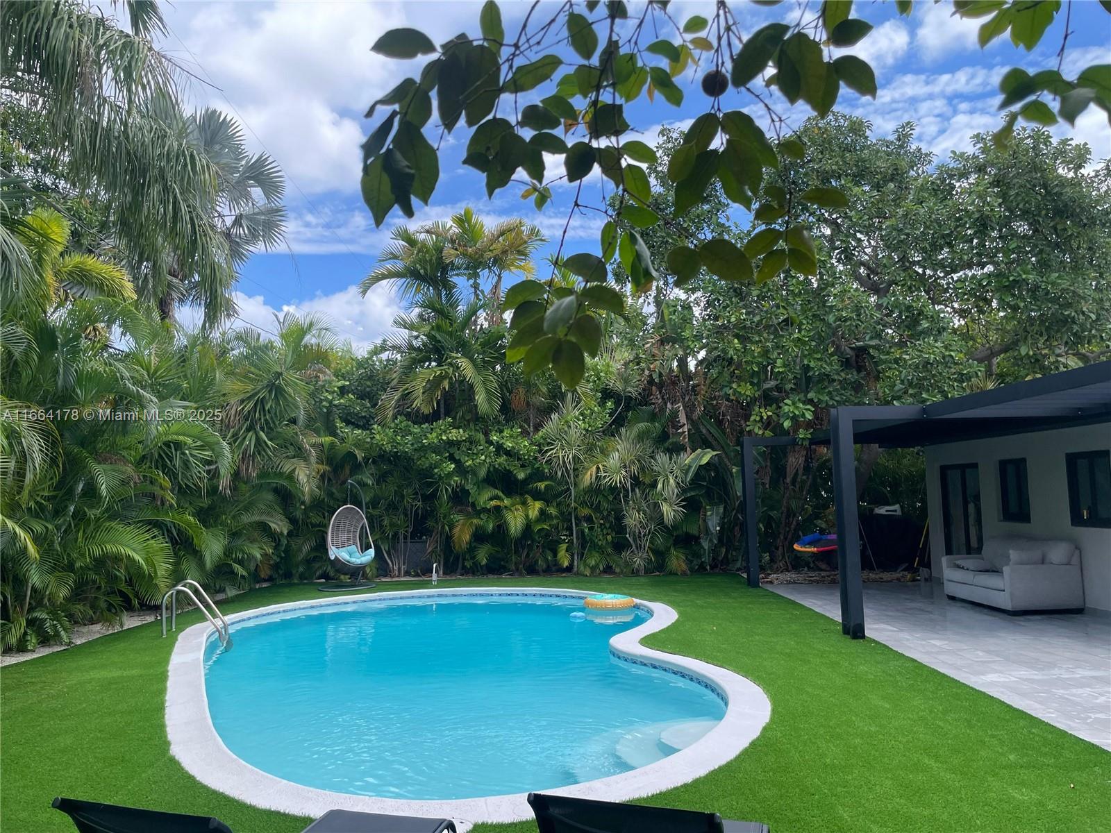 Tropical oasis living in the heart of North Miami, Located in prestigious gated community Keystone Point. Fully remodeled 4 bedrooms ( two of them with bathroom en suite) 3 bathroom single family home. This style home has ample living space, situated on a 8,400 SQFT lot.Impact doors and windows throughout the house. New exterior deck in front of the house and amazing back deck with incredible lush vegetation. Central and individual air conditioning in the bedrooms. New roof with 10 year warranty. Brand new bathrooms. New pool with lighting, pump and filter. Computerized sprinkler irrigation. Computerized garden lighting. New electrical system throughout property. Garden designed and developed by prestigious landscape professional. Pergola in the rear deck. New perimeter fence.