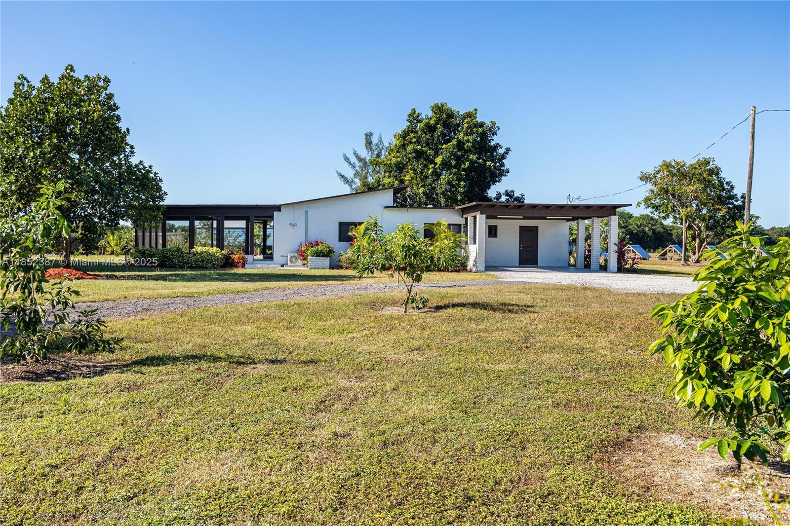 Farm living at its finest! This charming 3/2 home has been recently updated. No expenses spared with a new kitchen including stainless steel appliances, new Impact windows, updated electrical, updated Plumbing, a new roof and brand new washer and dryer on site. The property also offers a detached 1 bed 1 bath that can be used as an extra bedroom or home office. This home offers comfort and serenity, and peaceful living with easy access to major routes into Homestead or Miami. This property is conveniently located very close to Schenebly"s Winery, Homestead Municipal Airport, Homestead Speedway 15 minutes from Everglades National Park and 30 minutes away from Key largo.