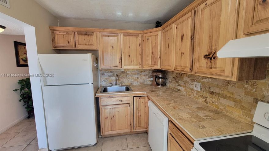 FULLY UPGRADED AND FURNISHED 2B/2B condo in a charming 55+ community. This is Florida living at its best! Step into this bright and spacious fully upgraded unit featuring IMPACT WINDOWS, an enclosed window balcony with an IMPACT SLIDING DOOR, ceramic tile flooring throughout and a modern upgraded primary bathroom. The primary bedroom offers a generous walk-in closet for ample storage. Enjoy peace of mind with a 2018 A/C and brand-new appliances. Unit also includes an additional storage space. The community offers a resort-style lifestyle with 4 pools, 2 tennis courts, clubhouse, shuffleboard, and a ping pong table. Conveniently located near major highways, Sawgrass Mills Mall, dining, and entertainment, just 25 minutes to the beach and to the airport.