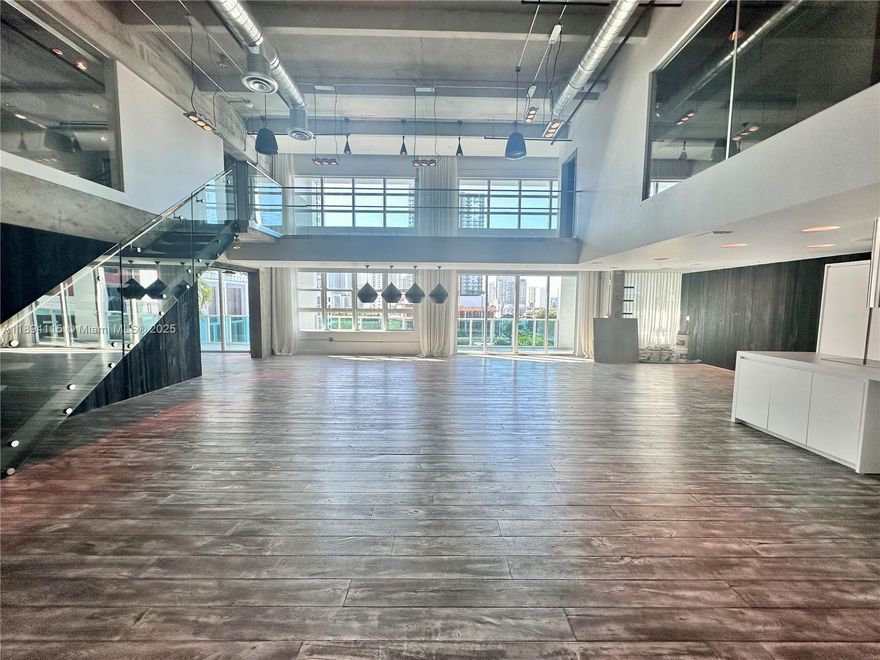 IMPECCABLE.. 2 story 3,200 Sq ft PH close to dwtn Miami & Wynwood. No expense spared in this “ultra cool loft” from fixtures to the finishes, soaring 20’ ceiling heights & wood floors throughout.  A premier Loft space w/ bridge connecting 2 bedroom on 2nd floor w/ 550 sqft covered terrace. #608 has been exquisitely upgraded w/ Italian kitchen cabinets, NEF coffee machine, oven, DW, Viking refrigerator, Crestron prodigy lighting system, black glass Italian doors, light fixtures by Tom Dixon.  All bedrooms equipped w/ TV & stereo for the common area. Laundry rm w/ Bosch lg capacity W/D. The 3rd bedroom was designed to work equally as a family rm/media rm w/ a lg barn door separating it from the Lvg room. Loft comes w/ 2 parking sp. Call LA for private showing.