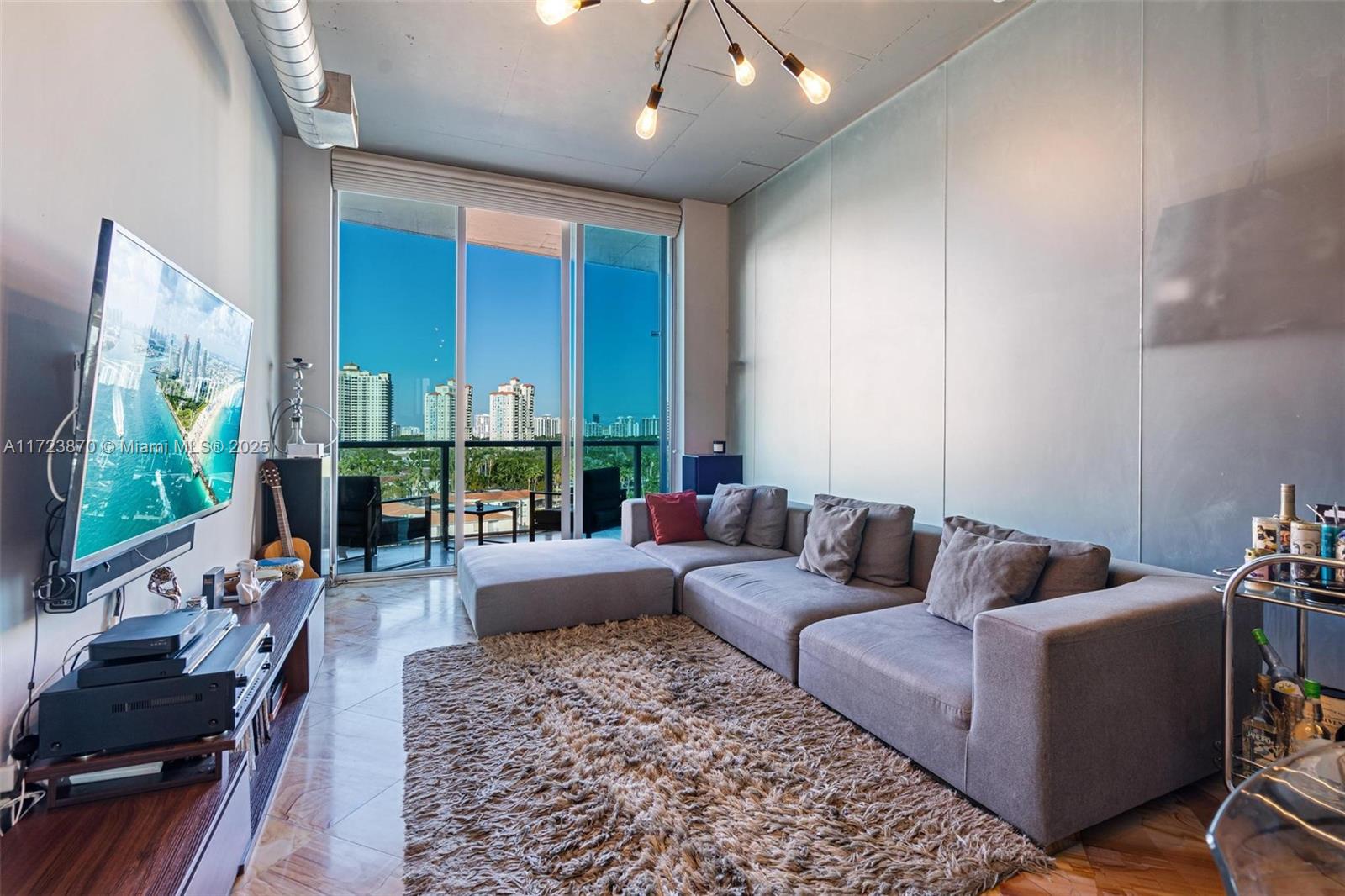 Experience the epitome of waterfront luxury at Loft 821 in Uptown Marina Lofts, Aventura. This 2-bedroom, 2-bathroom plus Den/Office residence spans 1,362 square feet, featuring an open-concept layout with natural marble flooring, an 11 foot glass wall, a gourmet kitchen with high-end stainless steel appliances, and a serene master suite with a built-in closet and spa-inspired en-suite bathroom. Boasting a private boat slip for vessels up to 60 feet with direct Intracoastal access, this home is perfect for boating enthusiasts. Boat Slips also for sale for $200,000. Residents enjoy resort-style amenities, including a fitness center, swimming pool, tennis courts, and more, all within a pet-friendly building. Located minutes from Aventura Mall, fine dining, and pristine beaches.