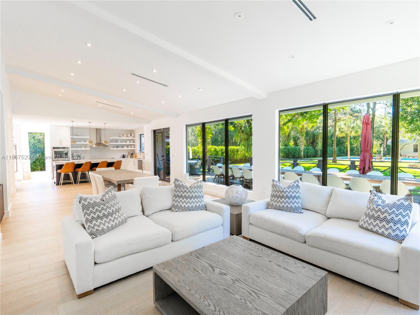 Welcome to 317 Bayberry Dr, a stunning single-family home on a full acre. This 4,440 sq ft residence features 4 beds, 5.5 baths, a dedicated office, playroom, complete with a fully equipped guest house. The home boasts elegant architectural elements such as built-ins, decorative moldings, exposed brick and high ceilings.Enjoy serene garden views and natural light throughout the space, complemented by custom window treatments. The expansive lap pool and lush garden offer a tranquil outdoor retreat. The chef's kitchen is a focal point for entertaining, featuring quartz countertops, a breakfast bar, double oven, and more. The primary ensuite is a luxurious haven with a double sink bathroom, separate shower, and tub. Experience sophisticated living at 317 Bayberry Dr—schedule a showing today!