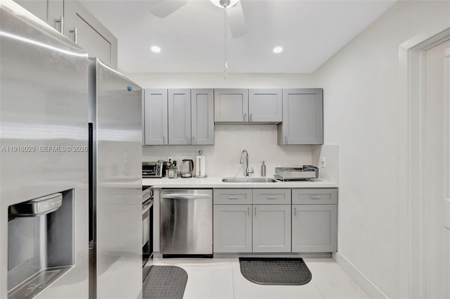 This bright and airy home offers the perfect blend of comfort, convenience, and outdoor space. Inside, you’ll find porcelain tile flooring, an updated kitchen with stainless steel appliances, and plenty of natural light through large hurricane impact windows. The home also features a newer roof, tankless water heater, AC unit, all-new air ducts and vents, a full-sized washer and dryer and a private 2-car driveway. Step into a generously sized, fully fenced backyard featuring a covered patio perfect for outdoor entertaining, relaxing, and giving pets room to play. Just minutes from downtown Ft. Lauderdale, Las Olas, the beach, airport, cruise port, and a wide range of shopping and dining options. Just 2 miles from the Brightline train station. LANDSCAPING INCLUDED!