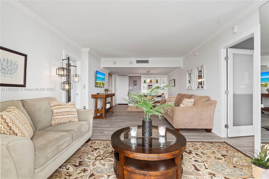 Renovated & Priced to Sell! This bright 2-bed, 2-bath condo is located in the heart of Aventura on the prestigious Country Club Drive, just steps from the Turnberry Golf Course and minutes to the Aventura Mall. Enjoy a spacious layout with floor-to-ceiling windows, a semi-open updated kitchen, brand-new flooring, and hurricane shutters. The primary suite offers a private bath and a custom walk-in closet; The second bedroom also has an en-suite bathroom. El Dorado features resort-style amenities including a pool, jacuzzi, BBQ area by the canal, gym, library, and game room. Close to beaches, shops, top schools, restaurants & major airports. A must-see!