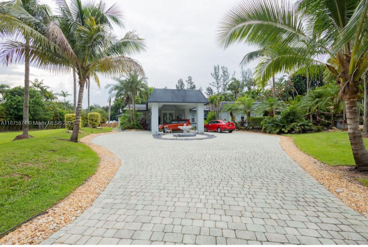 Welcome to this FURNISHED Unique & located in the Heart of Davie on a Double Wide Acre Corner Lot. Pool Home. impressive array of Exotic Tropical Plants/Palms. Formal Dining Room, Living Room, Expansive Screened-in Pool & Spa. Modern LivingOne of a Kind Luxurious Resort Style Home Photos Can't Say It All, Must see Home in Person to Truly See & Appreciate All Features of This Unique Jewel.One of a Kind ***TROPICAL OASIS***