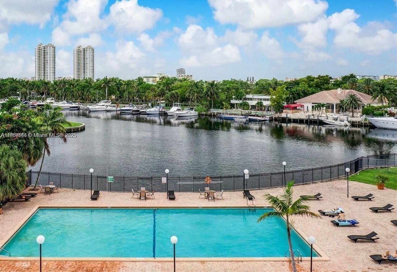 Waterfront gated Three Islands community. Bright and spacious, floor-to-ceiling wall-to-wall windows, pool, tennis
court, sauna. 40 years certification has been completed, Assessment paid. 5 minutes to the Beach, Walmart and
shopping plazas.