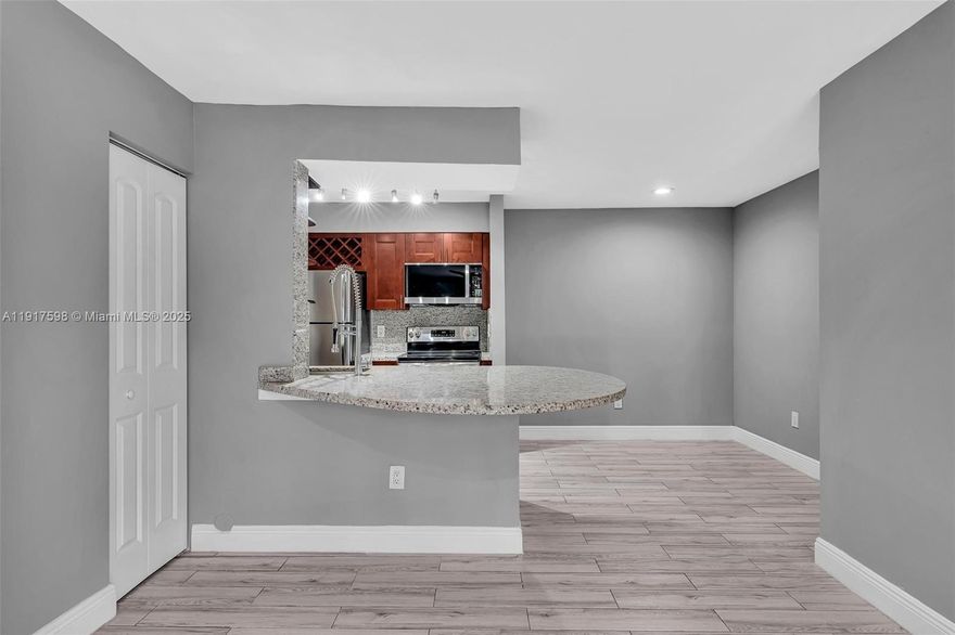 Upgraded 2BR/1BA first-floor condo in the gated community of Royal Poinciana. Available Immediately. Newly renovated with granite counters, stainless steel appliances, porcelain tile floors, and walk-in rain shower. Features include in-unit washer/dryer, screened patio with storage closet, and walk-in closet. Community offers resort-style amenities: pool, fitness center, car wash station, lakeside walking path, and a large enclosed dog park. Prime location with easy access to I-95 and the Turnpike, close to shopping, dining, and entertainment. Water and trash included. Pet-friendly with no pet fees.